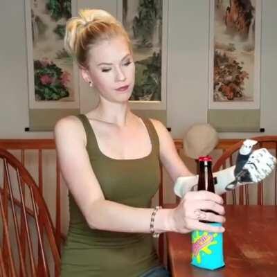 Opening a beer with a cyborg arm