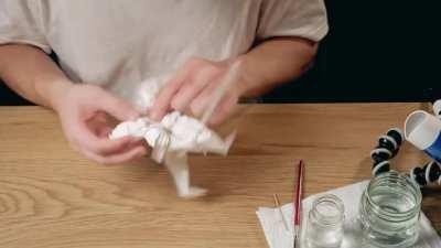 Folding a single square sheet of paper for over 40 hours into an origami knight, without any cutting or tearing.