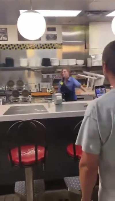 Female Waffle House Employee catches chair thrown by angry male customer. pulls it off like an action protagonist