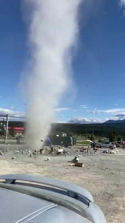 Massive dust devil demolishes man's fruit stand while he watches, returns to hit it again