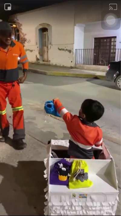 Little boy gets very happy and excited to see the garbage truck. Driver stops to say hi!