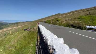 Professional motorcycle racer Michael Dunlop flat out (+180mph) over the mountain section at the Isle of Man TT races. Headphones recommended, volume up.