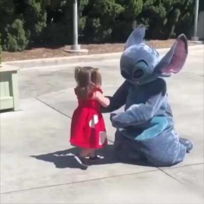 Little girl falls so Stitch does too to make her feel better