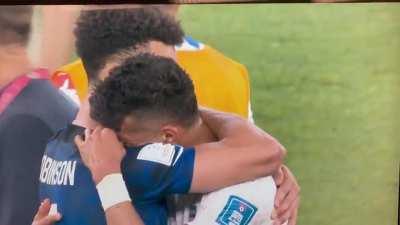 USA and Iranian Football Players Embracing Each Other After Game