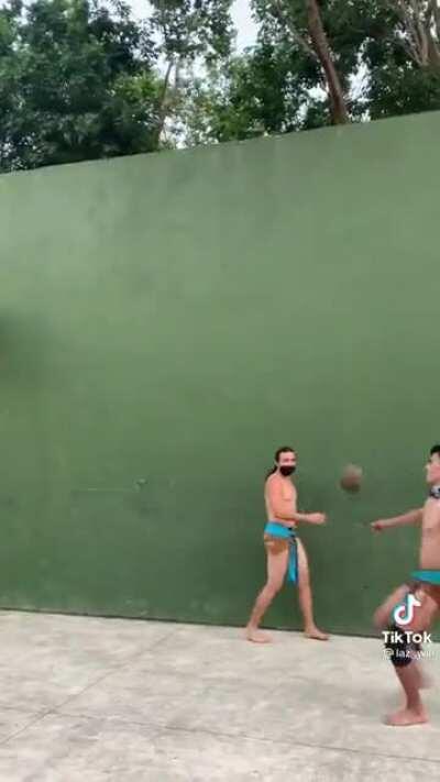 Guys playing an ancient mesoamerican ballgame