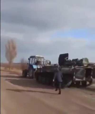 Russian BTR being towed by civilians [ another vid]