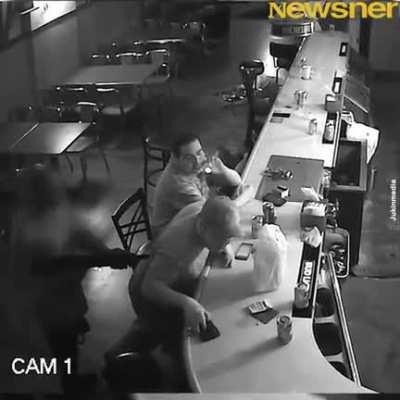 To intimidate this guy while robbing the bar