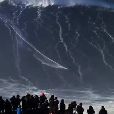 Surfing on a huge wave