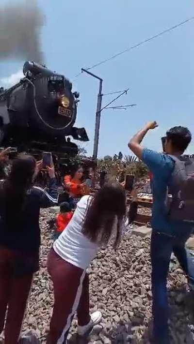 Girl in Mexico taking a selfie with her child gets hit by train.