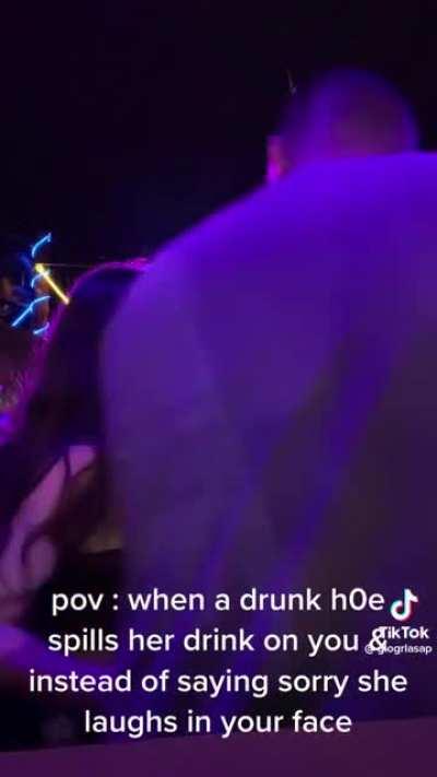 trashy woman gets a drink spilled from behind her, proceeds to freak out and do the exact same thing