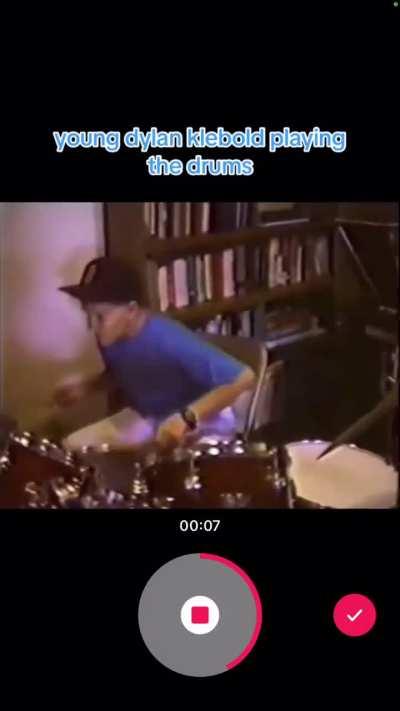 A young Dylan Klebold playing the drums