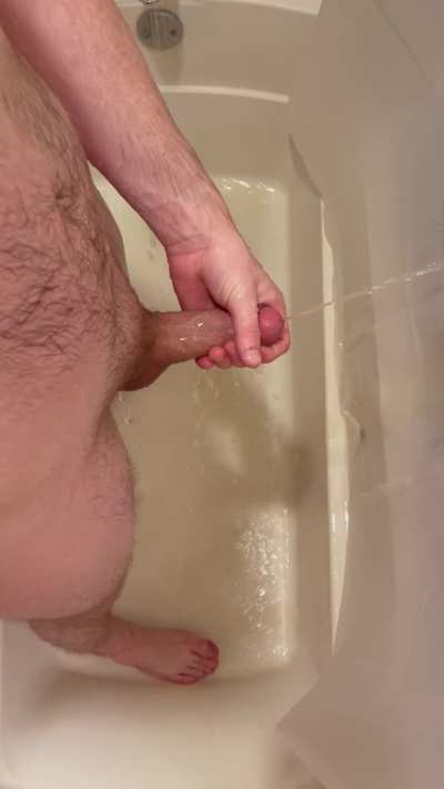 Pissing in the shower with my morning wood 