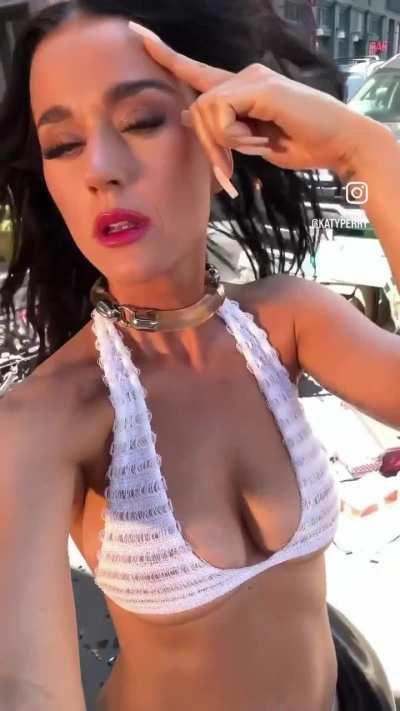 Katy Perry looking slutty in a white bikini 