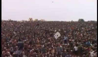 Dairy farmer Max Yasgur, the man who agreed to host the 1969 Woodstock music festival on his farm, is seen here giving a speech to over 400,000 attendees.