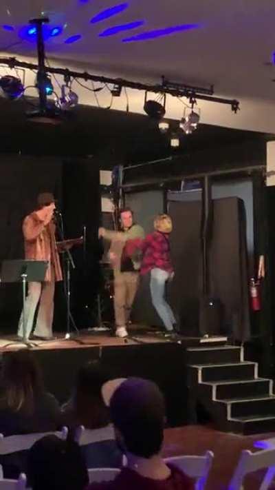 Heckled assaults comic on stage