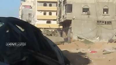 Palestinian Islamic Jihad militant firing anti tank missile at an Israeli tank in Gaza City