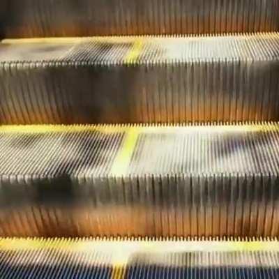 Light falling down an escalator.