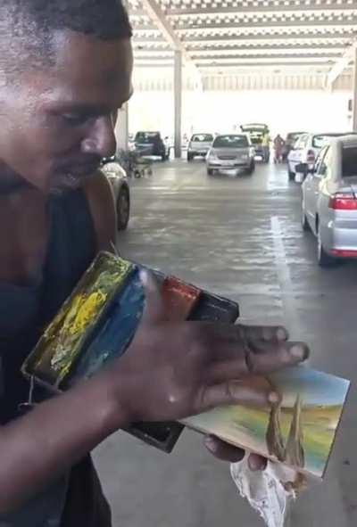 This skilled man can create a painting using just his fingers and hand