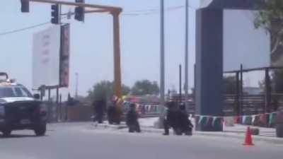 Mexican Federal Police (Policía Federal) Shootout with Cartel de Golfo, officers cheer on as armored Federal Police truck shows up with a mounted 50 Cal