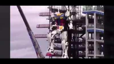 18 Meters/ 60 Ft Tall Gundam Robot in Yokohama, Japan tested its first step.