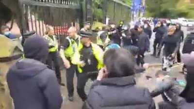 Staff of Chinese consulate in Manchester destroys Hong Kong protest signs and drags protesters into consulate to beat them up