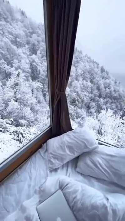 Looking out at a winter wonderland from a hotel window in the country of Georgia