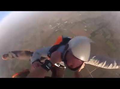 Man saves a friend who got knocked out by another friend during a skydive