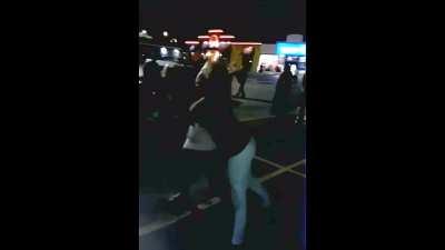 White women fight in a dark parking lot (no sound)