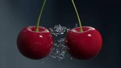 Two washed cherries bump into each other in slow motion