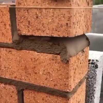 Laying Brick and removing excess mortar