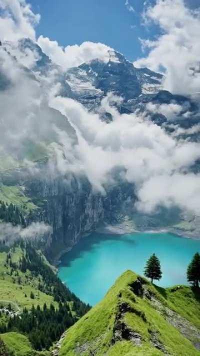 Oeschinen Lake in the Swiss Alps with these mesmerizing clouds!