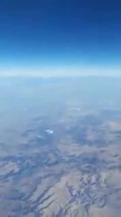 Apparent footage taken out of a plane with an unidentified object that dematerializes.