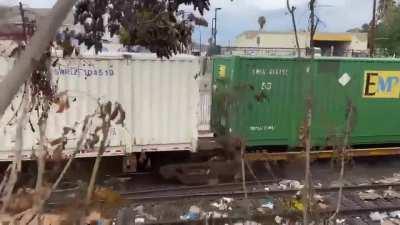 Train becoming derailed after driving through trash/debris