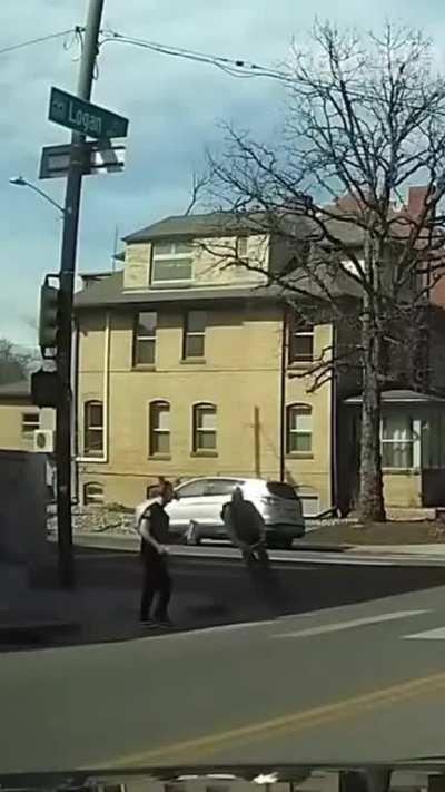 Biker pushes the pedestrian and rides off like nothing happened