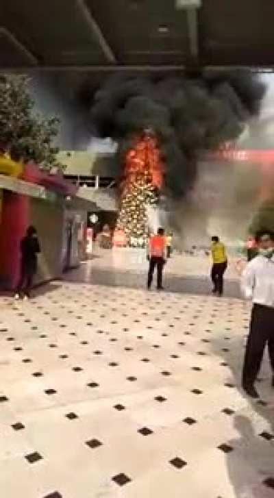 Xmas tree engulfed in flames. Jockey Plaza Shopping Centre. Lima, Peru