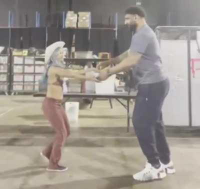 Mercedes Moné dancing with Satnam Singh over a hindi song backstage 