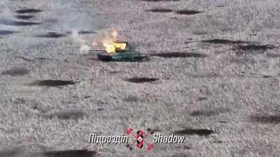 The Ukrainian &quot;Shadow&quot; drone unit released another video how a drone pilot drops a US M67 grenade through the open hatch of a Russian T-80 BVM. High difficulty level in this video and turret toss included.