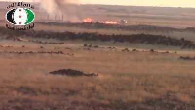 Ansar al-Sunnah Brigade BGM-71 TOW team hits an SAA tank, causing an immediate cook-off - 10/5/2014