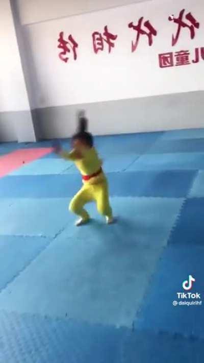 Little kid doing back handsprings