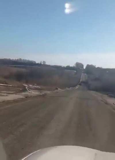 Russian tank runs out of Fuel, gets stuck on Highway Driver offers to take the soldiers back to russia. Everyone laughs. Driver tells them that Ukraine is winning, russian forces are surrendering and implies they should surrender aswell.