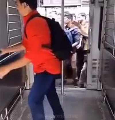 Slow-Mo shot of people boarding a moving train to work