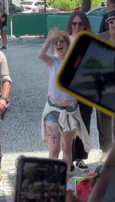 Hayley waving to fans