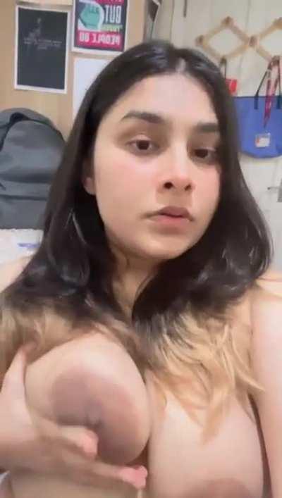 Beautiful Indian girl pressing her boobs