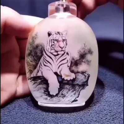 This artist creates his artwork inside bottles