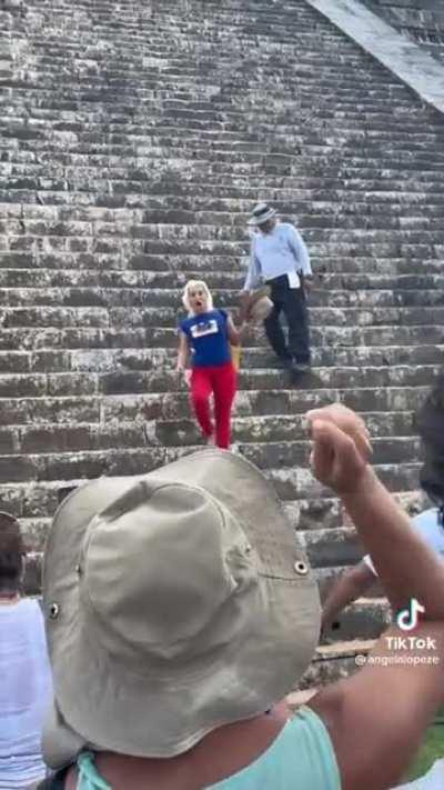 Lady climbs and poses on sacred site in Mexico; locals respond in kind.