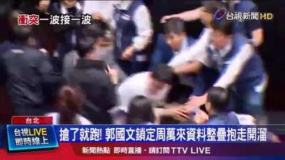 A member of Taiwan's parliament stole a bill and ran off with it to prevent it from being passed.