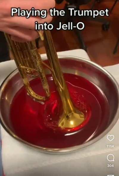 Trumpet being played through Jello