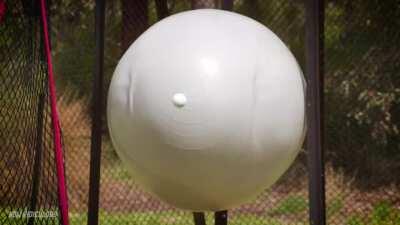 Golf Ball hitting off of an Exercise Ball