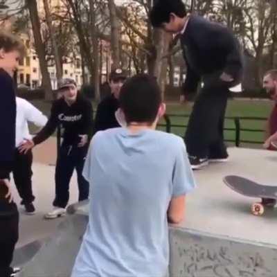 Fellow skateboarders help kid get over his fear of going down the ramp.