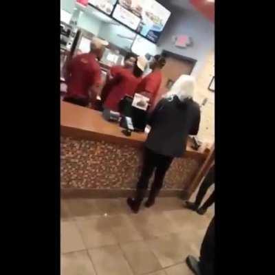 Racist individual gets full body slammed outside of restaurant